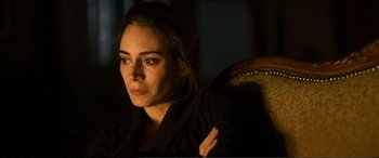 Movie still from “Winter Sleep” (2014), directed by Nuri Bilge Ceylan – A woman sitting in a chair with her hand on her shoulder; Close Up shot, High angle