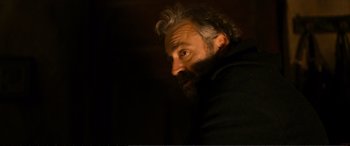 Movie still from “Winter Sleep” (2014), directed by Nuri Bilge Ceylan – A man with a beard is looking into the distance; Close Up shot, Low angle