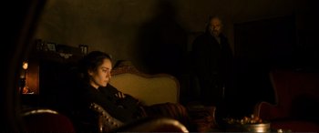 Movie still from “Winter Sleep” (2014), directed by Nuri Bilge Ceylan – A woman sitting on a couch next to an older man; Medium shot, Over the shoulder angle