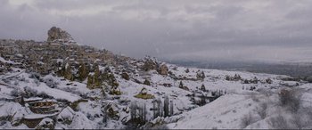 Movie still from “Winter Sleep” (2014), directed by Nuri Bilge Ceylan – A view of a snowy landscape from a hill; Extreme Wide shot, High angle
