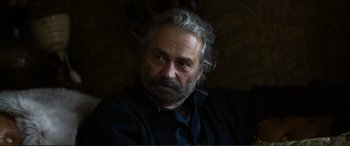 Movie still from “Winter Sleep” (2014), directed by Nuri Bilge Ceylan – An older man with a beard and a mustache; Close Up shot, Over the shoulder angle