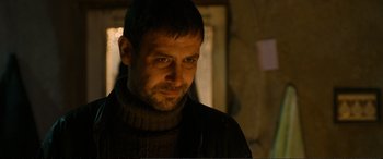 Movie still from “Winter Sleep” (2014), directed by Nuri Bilge Ceylan – A person wearing a sweater; Close Up shot, Low angle