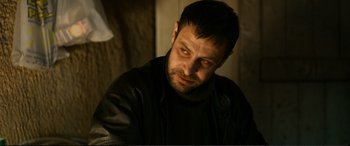 Movie still from “Winter Sleep” (2014), directed by Nuri Bilge Ceylan – A person wearing a black jacket; Close Up shot, Low angle