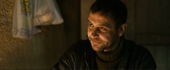 Movie still from “Winter Sleep” (2014), directed by Nuri Bilge Ceylan – A person wearing a sweater; Close Up shot, Low angle