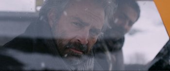 Movie still from “Winter Sleep” (2014), directed by Nuri Bilge Ceylan – A person looking out a car window; Close Up shot, Over the shoulder angle