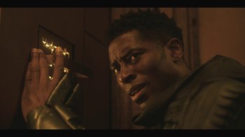 Movie still from “Another Life” (2019), created by Aaron Martin – A person holding a knife; Close Up shot, Low angle