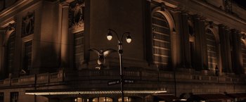 Movie still from “Winter's Tale” (2014), directed by Akiva Goldsman – A street light in front of a large building; Extreme Wide shot, Low angle