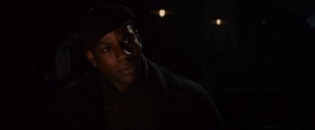 Movie still from “Winter's Tale” (2014), directed by Akiva Goldsman – A man wearing a hat and a jacket; Close Up shot, Over the shoulder angle