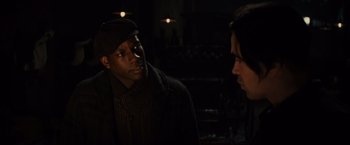 Movie still from “Winter's Tale” (2014), directed by Akiva Goldsman – A man and a woman talking in a dimly - lit room; Close Up shot, Over the shoulder angle
