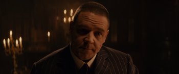 Movie still from “Winter's Tale” (2014), directed by Akiva Goldsman – A person wearing a suit and tie; Close Up shot, Low angle