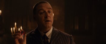 Movie still from “Winter's Tale” (2014), directed by Akiva Goldsman – A person wearing a suit and tie; Close Up shot, Over the shoulder angle