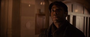 Movie still from “Winter's Tale” (2014), directed by Akiva Goldsman – A person wearing a hat and a jacket; Close Up shot, Low angle