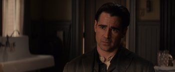 Movie still from “Winter's Tale” (2014), directed by Akiva Goldsman – A person wearing a suit and tie; Close Up shot, Over the shoulder angle