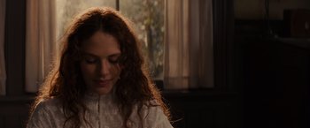 Movie still from “Winter's Tale” (2014), directed by Akiva Goldsman – A person wearing a white shirt; Close Up shot, Over the shoulder angle