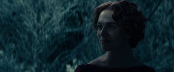 Movie still from “Winter's Tale” (2014), directed by Akiva Goldsman – A person wearing a red dress; Close Up shot, Over the shoulder angle