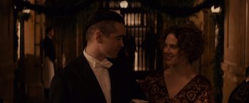 Movie still from “Winter's Tale” (2014), directed by Akiva Goldsman – A man and a woman in formal wear standing next to each other; Close Up shot, Over the shoulder angle