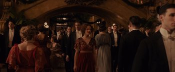 Movie still from “Winter's Tale” (2014), directed by Akiva Goldsman – A group of people standing around in a room; Wide shot, Over the shoulder angle