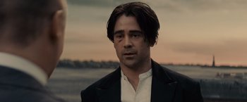 Movie still from “Winter's Tale” (2014), directed by Akiva Goldsman – A person wearing a suit and tie; Close Up shot, Over the shoulder angle