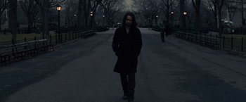 Movie still from “Winter's Tale” (2014), directed by Akiva Goldsman – A man with long hair is walking down the street; Medium shot, High angle