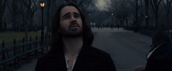 Movie still from “Winter's Tale” (2014), directed by Akiva Goldsman – A man with long black hair looking up at the sky; Close Up shot, Low angle