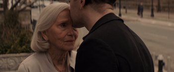 Movie still from “Winter's Tale” (2014), directed by Akiva Goldsman – An older woman and a younger man are kissing; Close Up shot, Over the shoulder angle