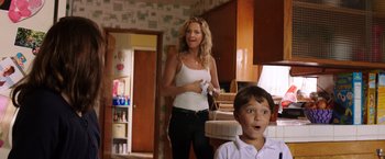 Movie still from “Wish I Was Here” (2014), directed by Zach Braff – A woman and a boy playing a video game in a kitchen; Medium shot, Over the shoulder angle