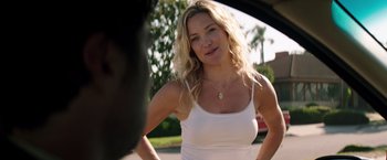 Movie still from “Wish I Was Here” (2014), directed by Zach Braff – A woman standing in front of a car on a street; Close Up shot, Over the shoulder angle
