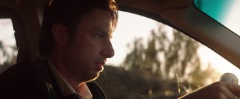 Movie still from “Wish I Was Here” (2014), directed by Zach Braff – A person looking out a car window; Close Up shot, Low angle