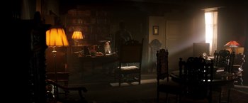 Movie still from “Wish I Was Here” (2014), directed by Zach Braff – A man sitting at a desk in a dark room; Wide shot, High angle