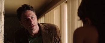Movie still from “Wish I Was Here” (2014), directed by Zach Braff – A person wearing a brown jacket; Close Up shot, Over the shoulder angle