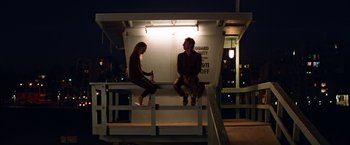 Movie still from “Wish I Was Here” (2014), directed by Zach Braff – Two people sitting on a bench at night; Wide shot, Over the shoulder angle
