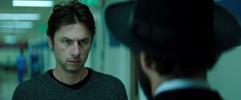 Movie still from “Wish I Was Here” (2014), directed by Zach Braff – A man looking at himself in the mirror; Close Up shot, Over the shoulder angle