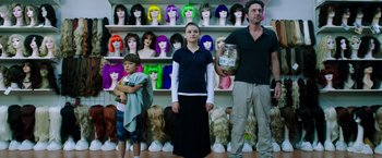 Movie still from “Wish I Was Here” (2014), directed by Zach Braff – A man and a woman standing next to each other; Medium shot, Over the shoulder angle