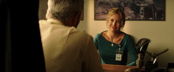 Movie still from “Wish I Was Here” (2014), directed by Zach Braff – A man and a woman are sitting at a table; Medium shot, Over the shoulder angle