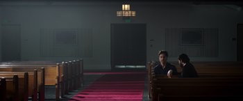 Movie still from “Wish I Was Here” (2014), directed by Zach Braff – A man sitting on a bench inside a church; Wide shot, Low angle