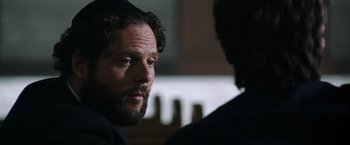 Movie still from “Wish I Was Here” (2014), directed by Zach Braff – A man with a goatee is talking to another man; Close Up shot, Over the shoulder angle