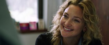 Movie still from “Wish I Was Here” (2014), directed by Zach Braff – A person with a smile on their face; Close Up shot, Over the shoulder angle