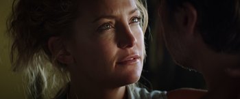 Movie still from “Wish I Was Here” (2014), directed by Zach Braff – A woman's face in the sunlight; Close Up shot, Over the shoulder angle