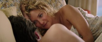 Movie still from “Wish I Was Here” (2014), directed by Zach Braff – A woman laying on a bed with a cat; Close Up shot, Over the shoulder angle