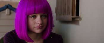 Movie still from “Wish I Was Here” (2014), directed by Zach Braff – A woman with purple hair is posing for a picture; Close Up shot, Over the shoulder angle