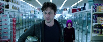 Movie still from “Wish I Was Here” (2014), directed by Zach Braff – A man and a woman walking in a shopping center; Medium shot, Over the shoulder angle