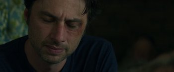 Movie still from “Wish I Was Here” (2014), directed by Zach Braff – A person with bruises on his face; Close Up shot, Over the shoulder angle