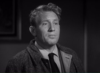 Movie still from “Without Love” (1945), directed by Harold S. Bucquet – An old photo of a man wearing a suit and tie; Close Up shot, High angle