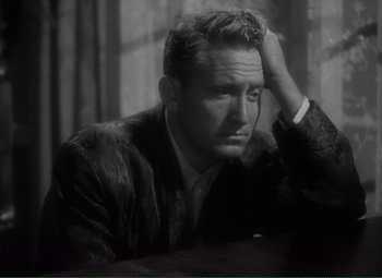 Movie still from “Without Love” (1945), directed by Harold S. Bucquet – An old photo of a man in a fur coat; Close Up shot, High angle