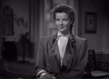 Movie still from “Without Love” (1945), directed by Harold S. Bucquet – A black and white photo of a woman in a suit; Close Up shot, High angle