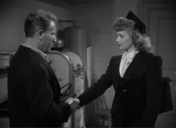 Movie still from “Without Love” (1945), directed by Harold S. Bucquet – A man and a woman shaking hands in a room; Medium shot, Over the shoulder angle