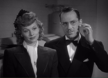 Movie still from “Without Love” (1945), directed by Harold S. Bucquet – A man and a woman posing for a picture; Close Up shot, Low angle