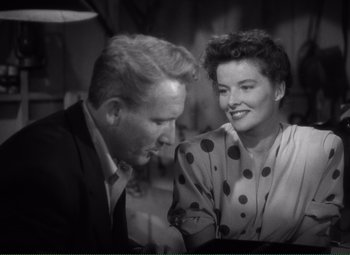 Movie still from “Without Love” (1945), directed by Harold S. Bucquet – An older man and a younger woman sitting next to each other; Medium shot, High angle