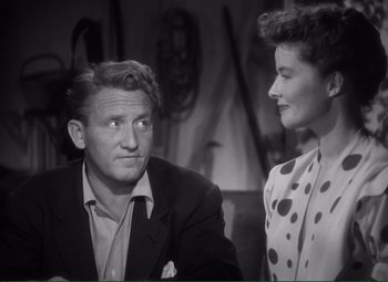 Movie still from “Without Love” (1945), directed by Harold S. Bucquet – A man and a woman are sitting next to each other; Medium shot, High angle