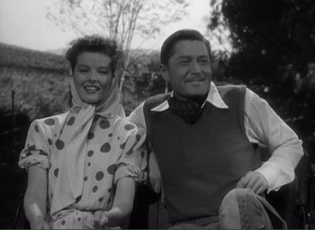 Movie still from “Without Love” (1945), directed by Harold S. Bucquet – A man and a woman sitting next to each other on a bench; Medium shot, Low angle